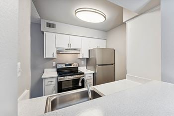 Upgraded white or mocha cabinets - in select apartments